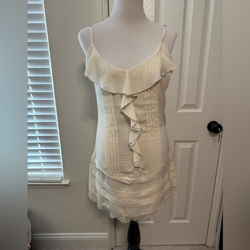 Elegant dress with ruffle details, perfect for a sophisticated occasion.